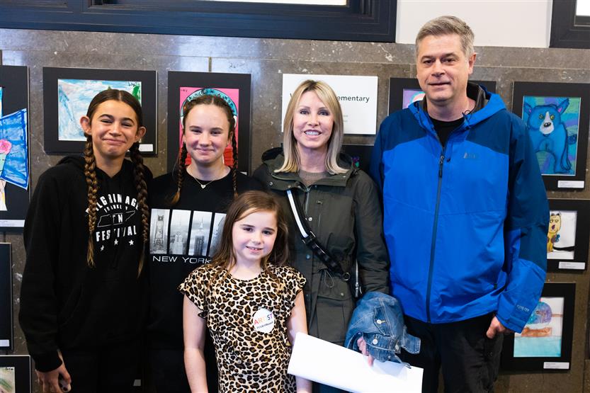 Students and their family at an art show